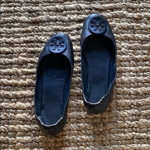 Black Tory Burch flats. Matte Black Miller logo
